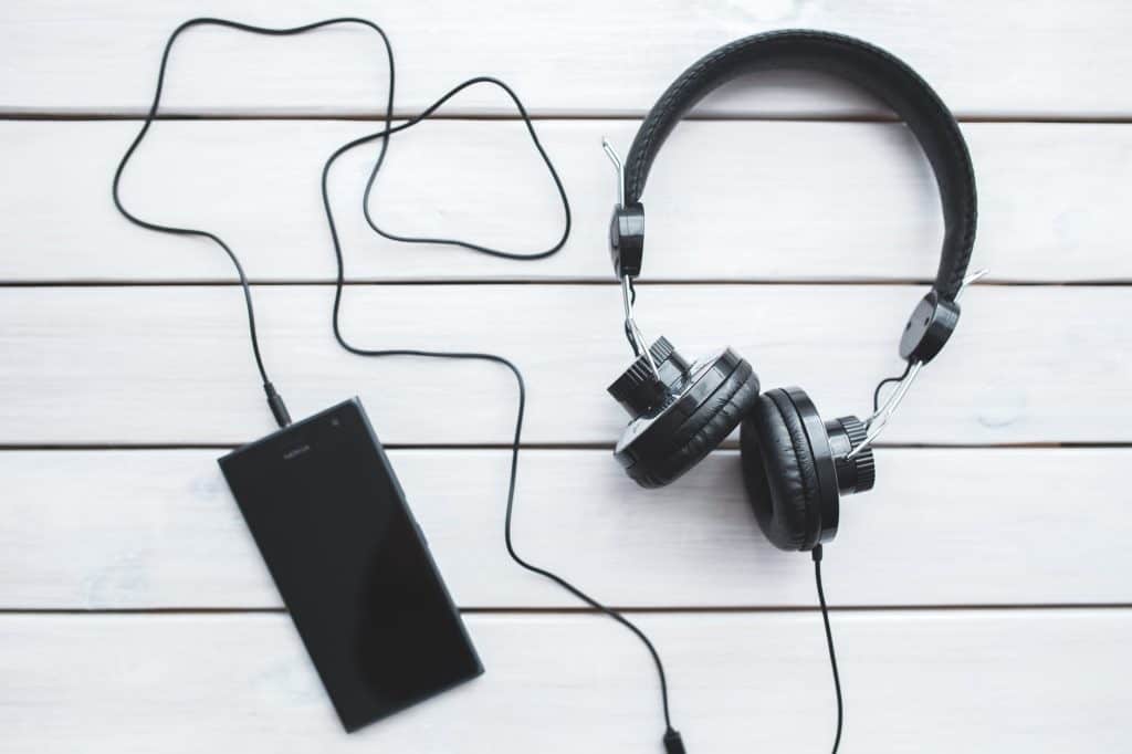 black headphones with mobile smartphone
